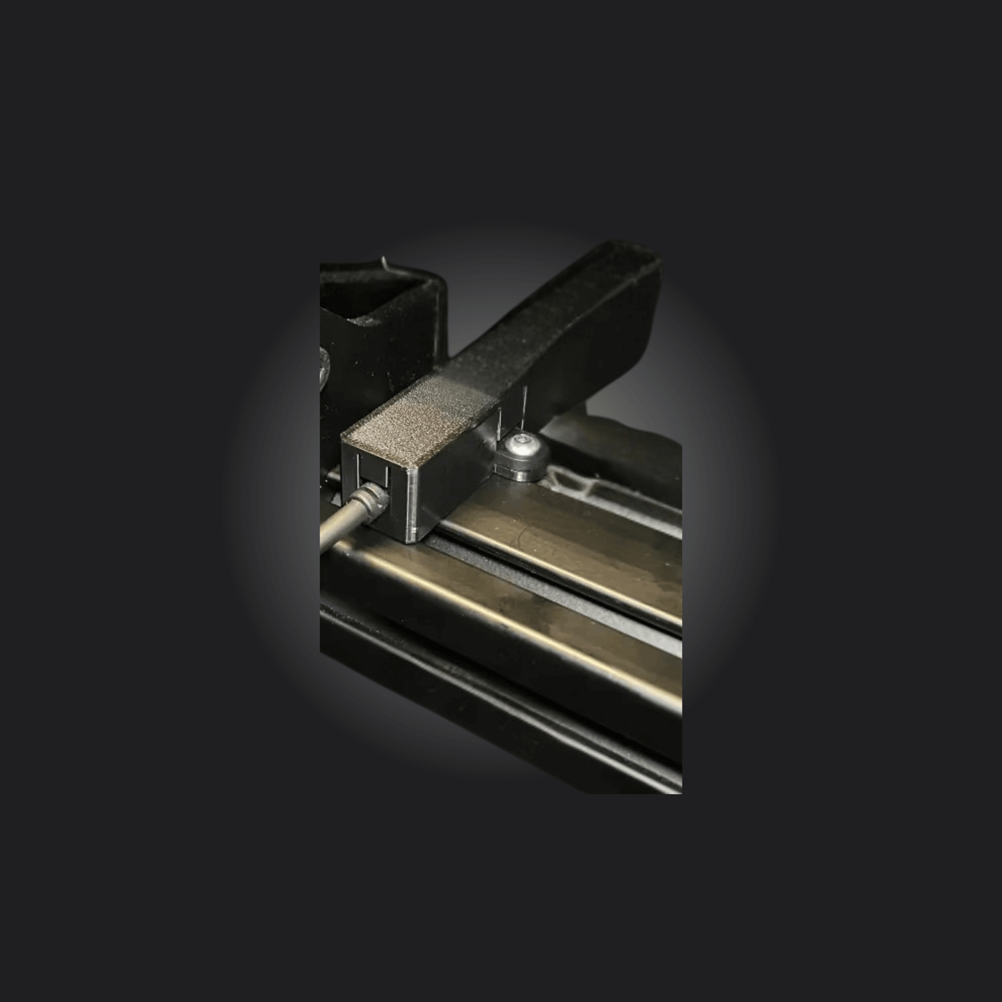Close-up of Simagic Link Enclosure ensuring secure USB connection for racing setups.